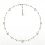 Adjustable pearl necklace with 6mm, 4mm and 3mm pearls on stainless steel chain with extension chain on white background